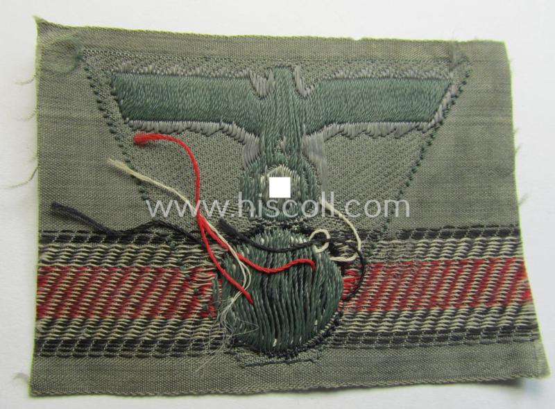 WH (Heeres) so-called: 'M43-pattern') cap-eagle/cocarde (ie. cap-trapezoid) as was specifically produced for usage on the so-called: 'M-43'-model field-caps (ie. 'Einheitsfeldmützen')