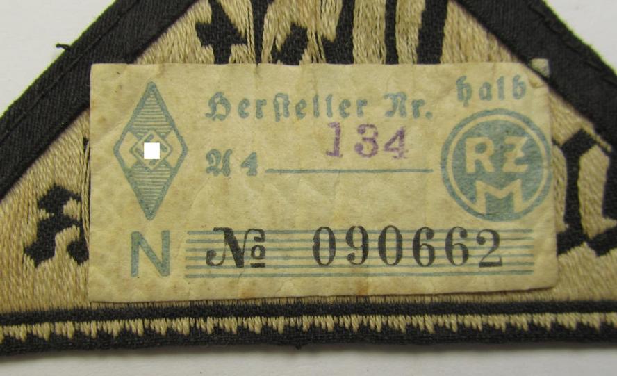 HJ/BDM ('Hitlerjugend' ie.: 'Bund Deutscher Mädel') district-triangle (ie. 'Gebietsdreieck') entitled: 'West Westmark' (being a 'virtually mint- ie. unissued' example that still retains its 'RzM'-etiket)