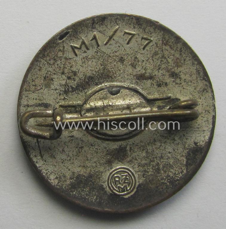 Superb - and nicely preserved! - 'N.S.D.A.P.'-membership-pin- ie. party-badge (or: 'Parteiabzeichen') bearing the makers'-designation: 'RzM' and/or: 'M1/77' (thus being produced by the 'Foerster & Barth'-company)