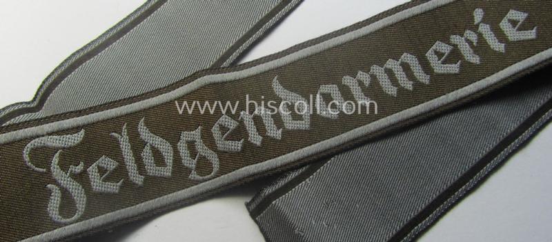 Hardly ie. never worn example of a WH (Heeres) cuff-title ie. armband (ie. 'Ärmelstreifen') entitled: 'Feldgendarmerie' (being a typical 'BeVo'-woven example)