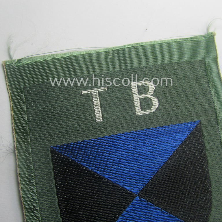 Eastern- (ie. Russian) volunteer (ie. Cossack-) related armshield as executed in the neat 'BeVo'-weave pattern depicting the interwoven 'Cyrillic' characters: 'TB' (as was intended for the Russian volunteers serving within the 'Terek Cossacks')