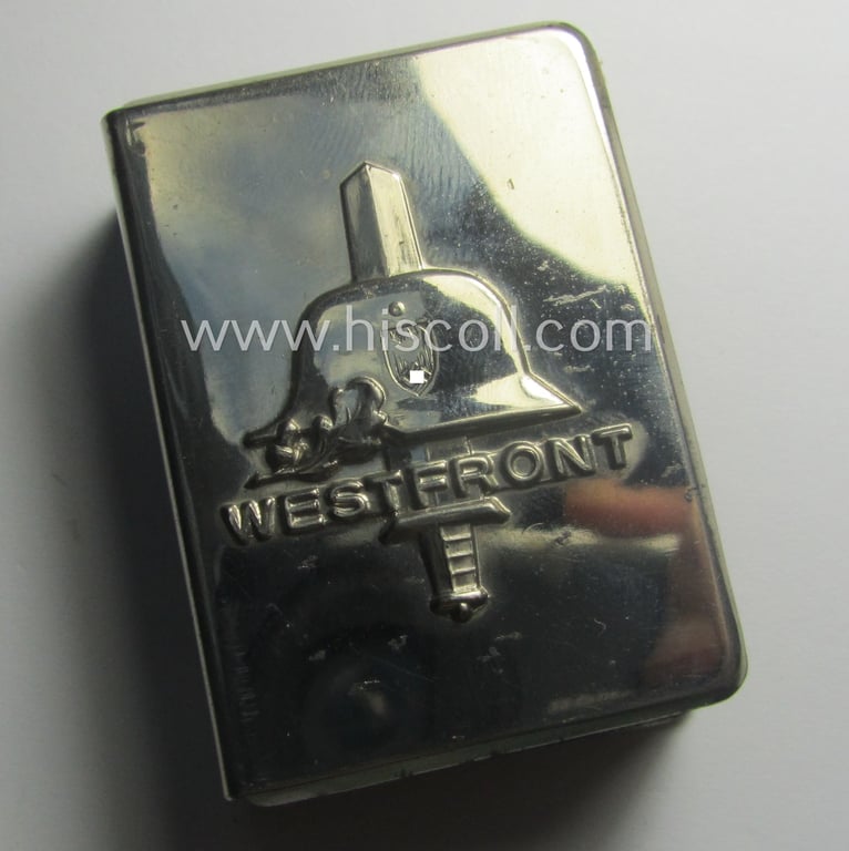 Interesting, WWII-period 'souvenir-item' (ie. match-box holder) showing on its front an illustration of a steel-helmet and upright-positioned sword coupled with the text: 'Westfront'