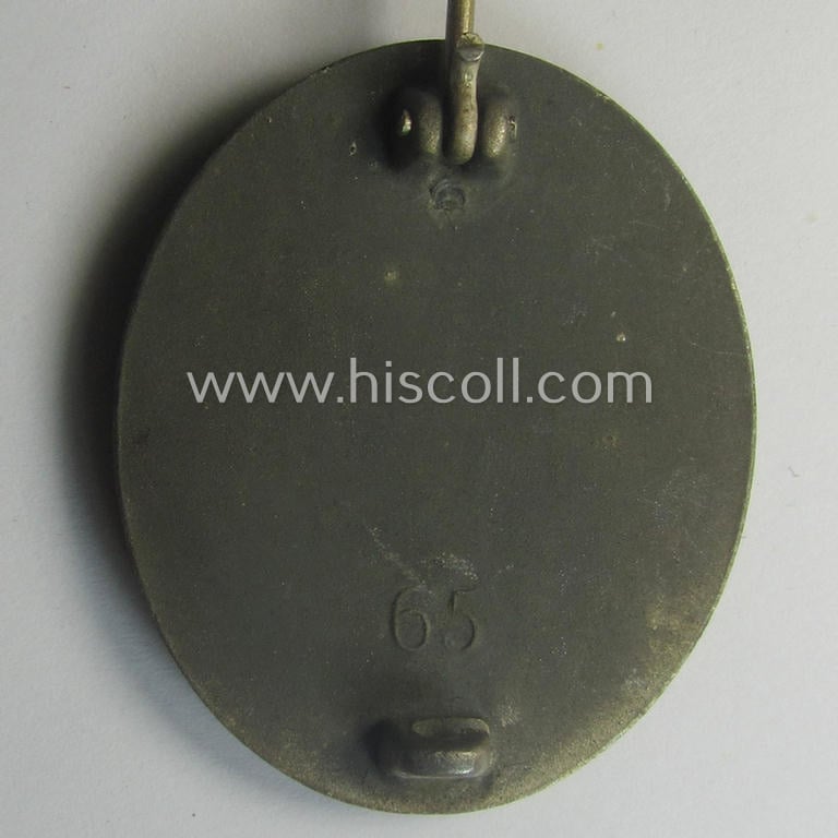 Moderately used- and/or worn 'Verwundeten-Abzeichen in Silber' being a typical maker- (ie. '65'-) marked- and/or: 'Feinzink'-based example by the maker: 'Klein & Quenzer'