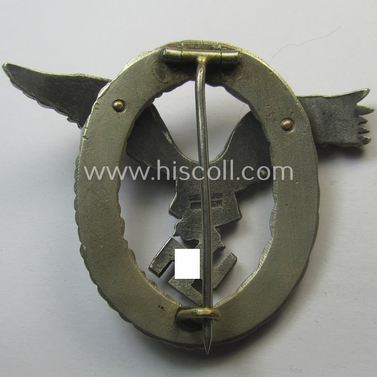 Early- (ie. pre-) war-period- and/or: 'Buntmetall'- (ie. 'Tombak'-) based: WH (Luftwaffe) 'Flugzeugführerabzeichen' (or: pilots-badge) being a maker- (ie. 'C.E. Juncker'-) marked example of the 'J3'-pattern