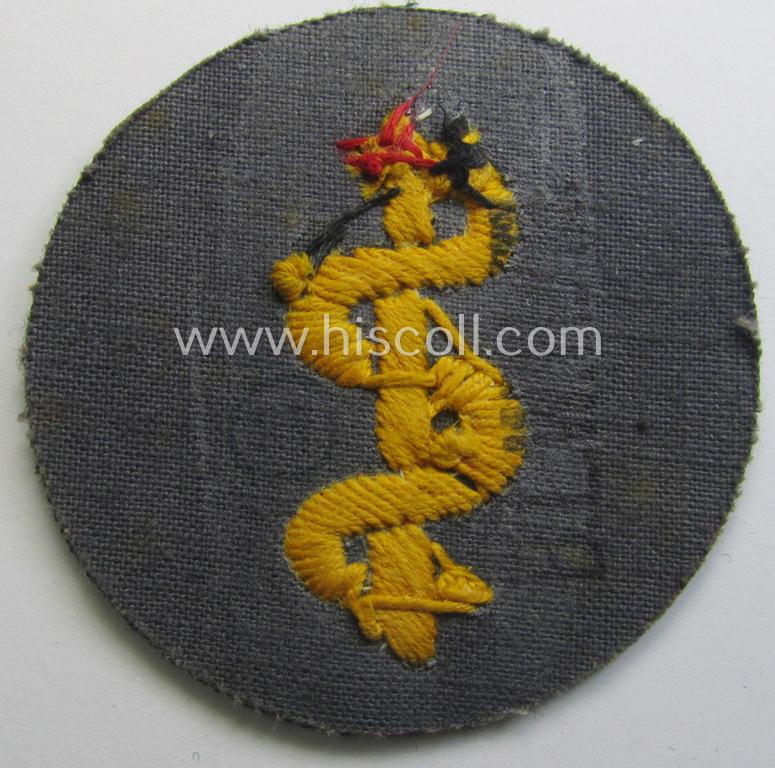 WH (Heeres) so-called: trade- and/or special-career arm-insignia as was intended for a: 'Sanitäter' being a neatly hand-embroidered (and maker-marked!) specimen