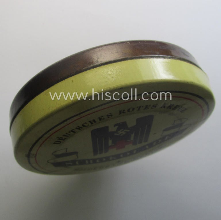Rarely seen DRK- (ie. 'Deutsches Rotes Kreuz'-) related (emergency) chocolate ration-tin of the make: 'Hildebrand - Berlin' being of the desirable 'variant'-pattern showing the 'DRK'-eagle and text: 'Schokolade' on its front