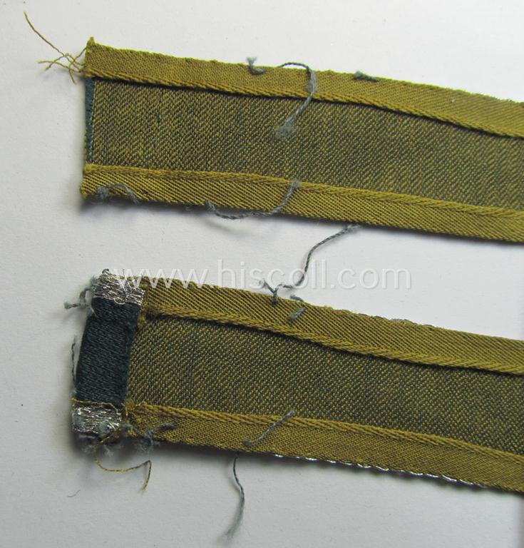 Attractive, 'BeVo'-like cuff-title (ie. 'Ärmelstreifen') entitled: 'Afrikakorps' being a with certainty issued and truly worn example that comes in an overall nice- (ie. hardly shortened- and/or once tunic-attached-), condition