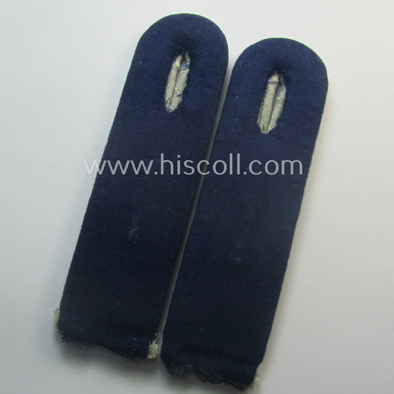 Pair of neatly 'cyphered', WH (Heeres) officers'-pattern shoulderboards as piped in the darker-blue-toned branchcolour as was specifically intended for a: 'Leutnant u. Arzt einer Sanitäts-Abtlgs.'