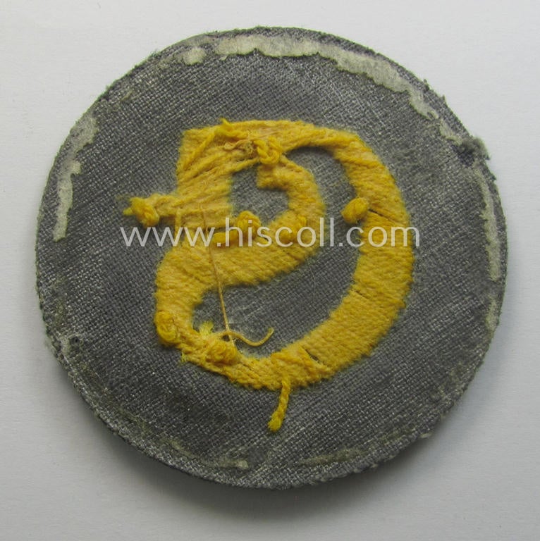 WH (Heeres) hand-embroidered, trade- ie. special-career arm-patch as was intended for a: 'Schirrmeister' (or: equipment-administration staff-member ie. NCO) being a maker-marked example as executed on darker-green-coloured wool