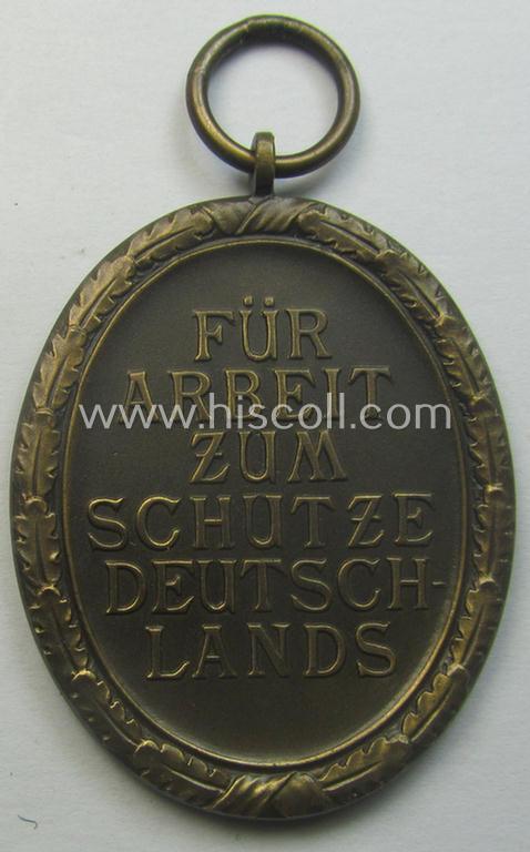 Medal-set: 'Deutsches Schutzwall Ehrenzeichen' (aka: 'Westwall'-medal) being a (typical) non-maker-marked- and/or: typical 'Buntmetall'-based specimen that comes packed in its original pouch of issue by the: 'Hermann Wernstein'-company