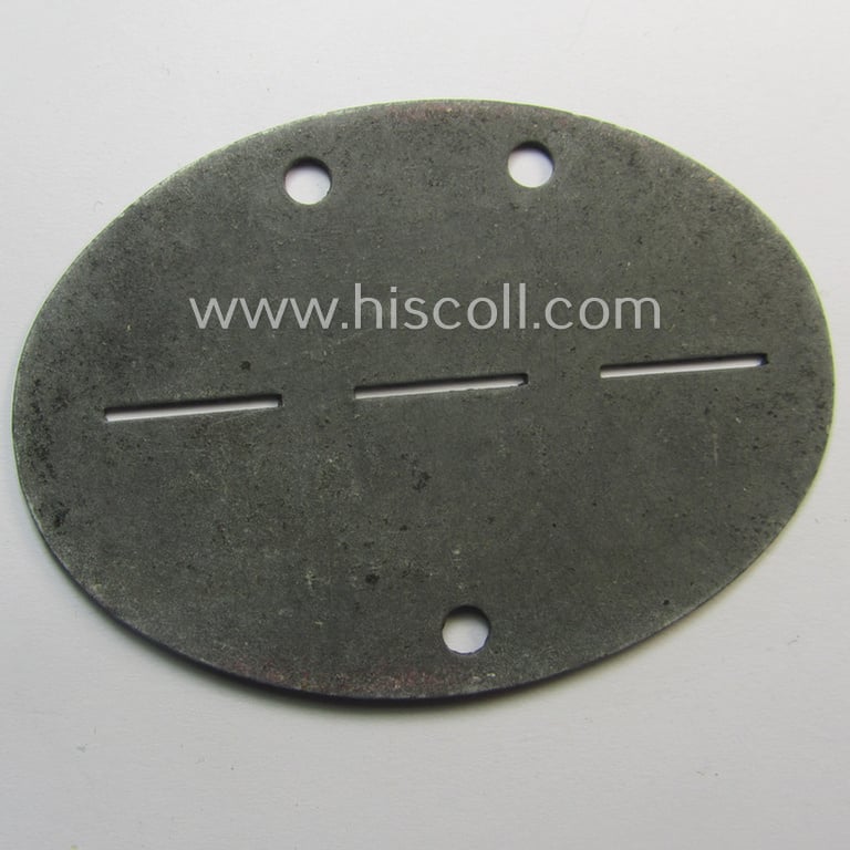Zinc-based, 'Deutsche Reichsbahn'- (ie. DRB-) related ID-disc bearing the clearly stamped unit-designation that simply reads: 'HVD Paris' and that comes as issued and/or worn