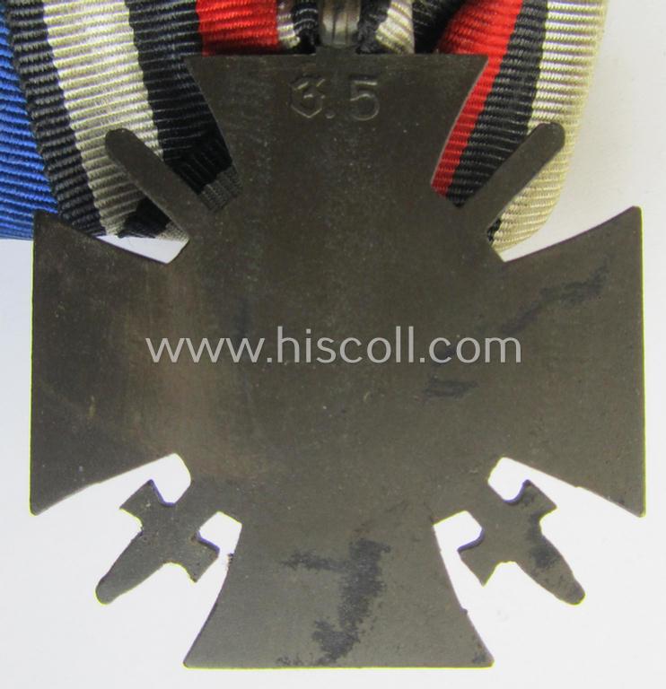 Two-pieced medal-bar (ie. 'Doppelspange') respectively depicting a WWI-period: 'Frontkämpferkreuz 1914-18' (ie.: 'Kriegsteilnehmerkreuz mit Schwertern') and a: 'Treuedienst Ehrenzeichen 2. Klasse'