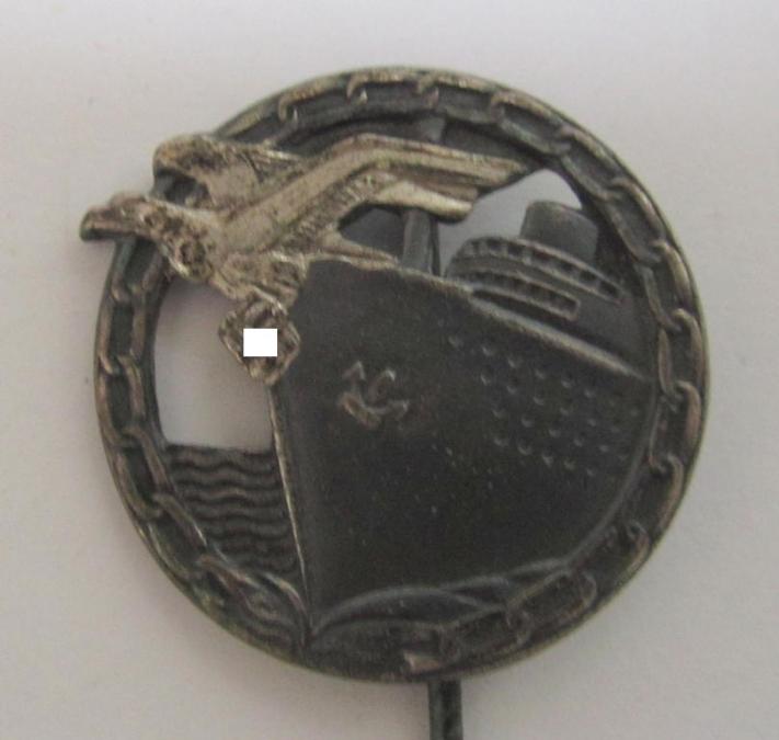 Attractive - and matching! - set comprising of a WH (KM) 'Blockadebrecher-Kriegsabzeichen' being a maker- (ie. 'Schwerin'-) marked example that comes together with its accompanying 'Halbminiatur', both pieces as executed in multi-coloured 'Feinzink'