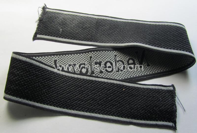 Superb, Waffen-SS, 1943/44 pattern cuff-title (ie. 'Ärmelstreifen') depicting the machine-woven Latin script text in silver-grey linnen as was intended for a member serving within the: '23. SS Freiwilligen Panzer Grenadier Division' ('Nederland...