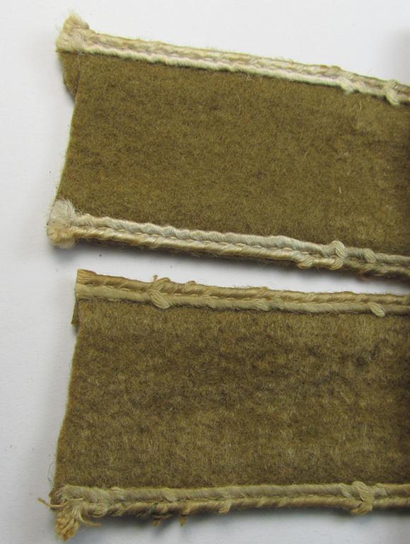 Attractive, WH (LW o. Heeres) cuff-title (ie. 'Ärmelstreifen') entitled: 'Afrika' (being a period-shortened- and woolen-based example that comes in a clearly issued- and/or worn condition)