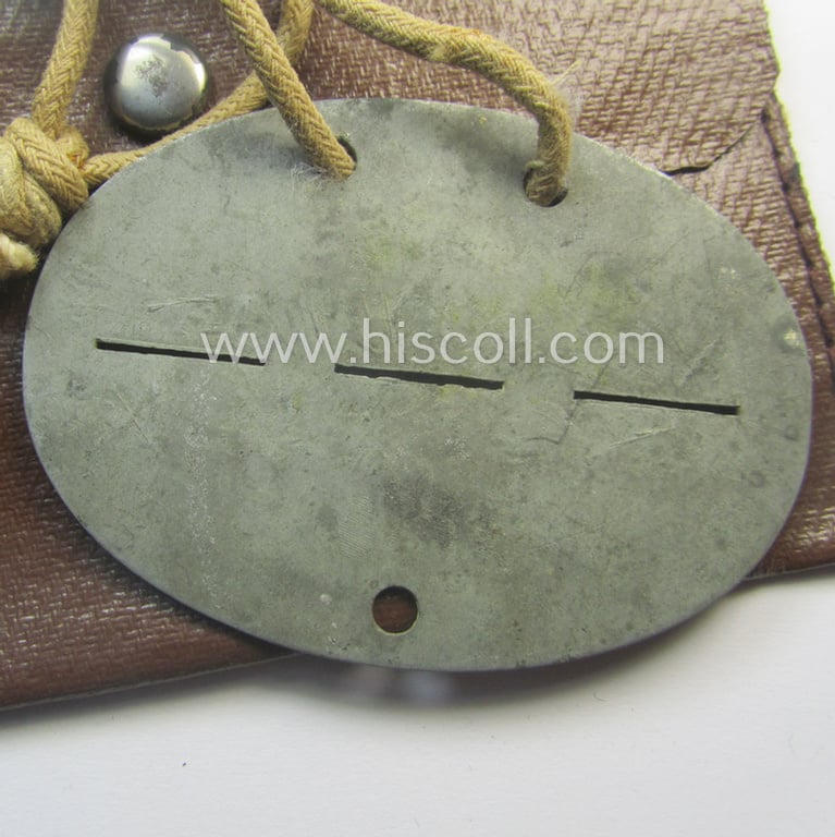 Zinc-based, WH (Heeres-) transport (ie. 'Nachshub'-) related ID-disc bearing the clearly stamped unit-designation: 'Stammkomp/Kf.Ers.Abt. 17' and that comes stored in its period-pouch as issued and/or worn