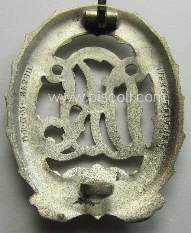 'Reichssportabzeichen DRL in Silber' (or: silver-class DRL sports'-badge) being a typical 'Buntmetall'-based example that is maker- (ie. 'Wernstein - Jena'-) marked