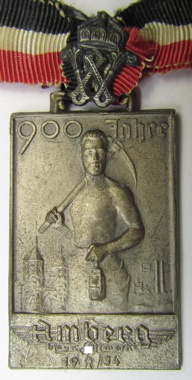 Commemorative, 'Buntmetall'-based 'Veranstaltungsabzeichen' (ie. 'tinnie') being a neatly maker- (ie. 'Carl Poellath'-) marked example that comes mounted on its ribbon showing the text: '900 Jahre Amberg - Bayr. Ostmark - 1934'