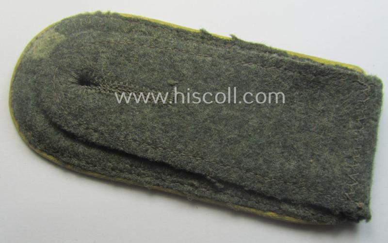 Single, early-war-period so-called: 'M40'- (ie. 'M43'-) pattern, WH (Heeres) tailor-made, NCO-type shoulderstrap as piped in the bright-yellow-coloured branchcolour as was intended for usage by an: 'Unteroffizier der Nachrichten-Trpn.'