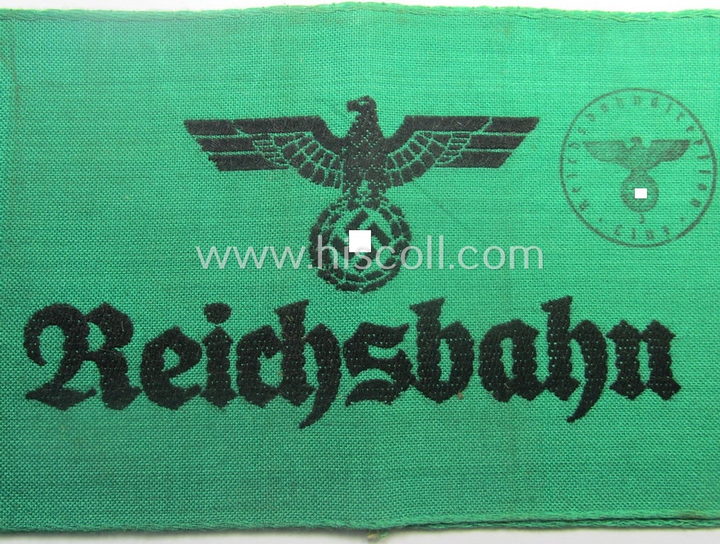 DRB- (ie. 'Deutsche Reichsbahn'-) related armband entitled: 'Reichsbahn' being of the 'entirely-woven'-type onto (typical) linnen-based cloth in a technique similar to the 'BeVo'-weave pattern