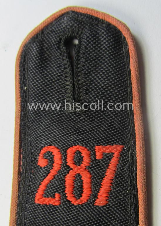 Single - and clearly worn - bright-red-piped so-called: 'Allgemeine-HJ'-shoulderstrap as intended for an: 'HJ-Oberkameradschaftsführer' who served within the 'Bann 287' (287 = 'Bann Offenbach' situated in the 'Gebiet West Hessen-Nassau')