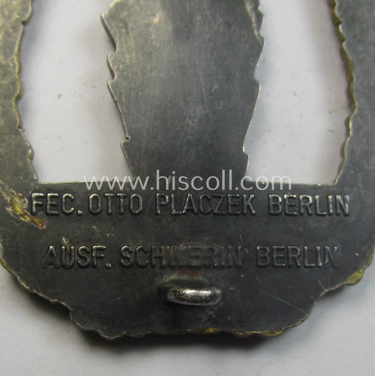 WH (Kriegsmarine) 'Kriegsabzeichen für Minensuch-, U-Boot-Jagd und Sicherungs-Verbände' (being a very detailed and clearly maker-marked example as executed in multi-coloured 'Buntmetall' as produced by the: 'Schwerin - Berlin'-company)