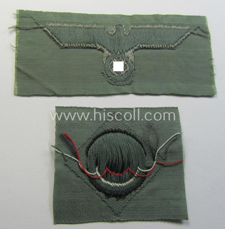 Early- (ie. mid-) war-period, WH (Heeres) cap-eagle & cocarde-set (ie. 'Schiffchenmützen-Adler u. Kokarde für Mannschaften u. Uffz.') being a 'virtually mint' set as executed in bluish-grey-coloured linnen on a field-grey-coloured background