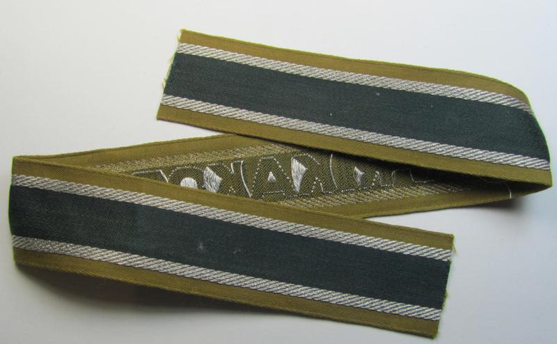 Superb, 'BeVo'-like cuff-title (ie. 'Ärmelstreifen') entitled: 'Afrikakorps' being a presumably issued but never worn example that comes in an overall very nice- (ie. non-shortened- and never tunic-attached-), condition