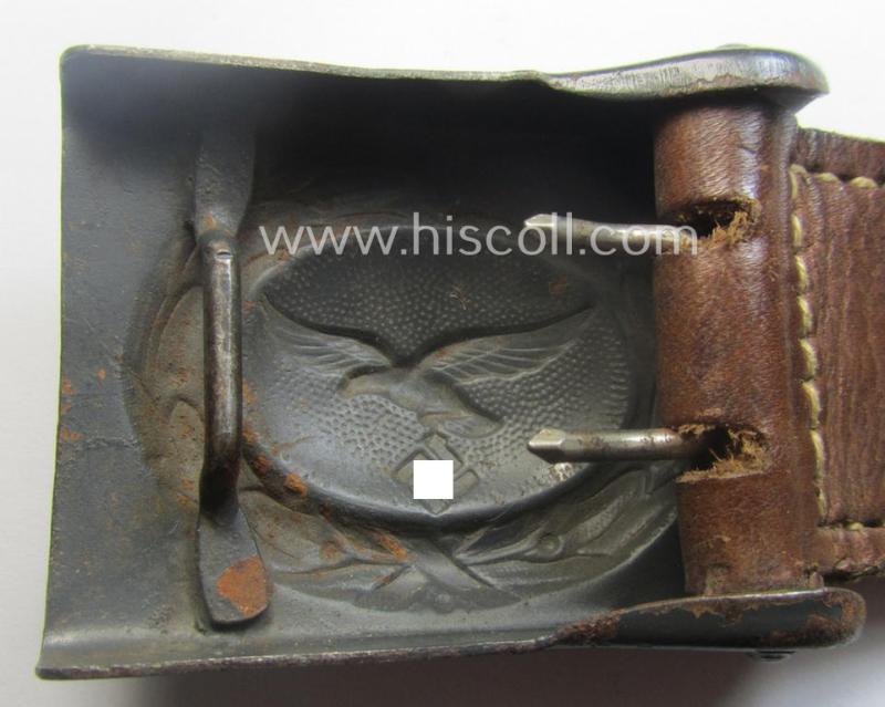 WH (Luftwaffe) blue-coloured- and/or steel-based belt-buckle, being a neatly maker- (ie. 'F.W. Assmann'-) marked and/or: '1941'-dated example that comes mounted onto its period, natural-coloured and/or leather-based tab