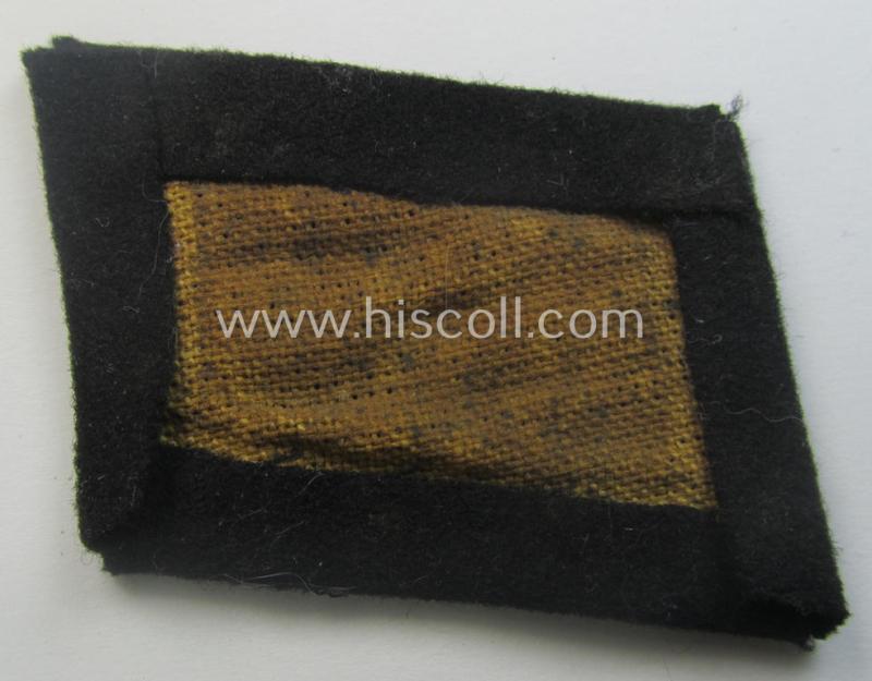 Waffen-SS EM-pattern rank-collar-rank-tab ('Kragenspiegel') being a 'standard-issue'-pattern example as executed in black-coloured wool as was intended for usage by an: 'SS-Mann'