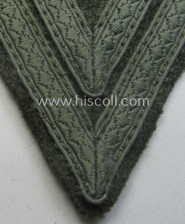 WH (Heeres) 'Armwinkel' (or: arm-chevron) as executed on typical field-grey-coloured wool as was specifically intended for usage by a soldier with the (unusually encountered!) rank of: 'Stabsgefreiter'