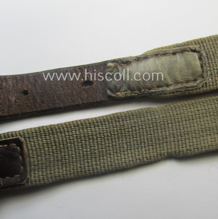 'Standard-issue'-pattern, WH trousers'-belt (or: 'Riemen für Hosen') as was executed in a combination of woven, field-grey-coloured linnen and/or brownish/black-coloured leather