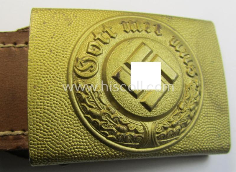 Stunning, bright-golden-coloured- and/or steel-based so-called: 'Wasserschützpolizei' belt-buckle being a maker- (ie. 'C.T. Dicke'-) marked- and: '1943'-dated example that comes mounted onto its 'typically-shaped' leather-based tab