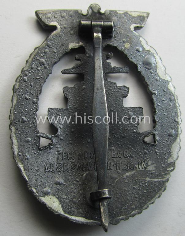 WH (KM) 'Flottenkriegsabzeichen' (or: high-sea fleet badge) being a typical zinc- (ie. 'Feinzink'-) based and/or (I deem) later-war-period version that is neatly maker- (ie. 'Fec. Adolf Bock' ) marked on its back