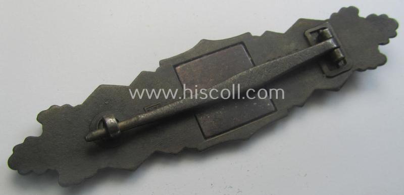 'Nahkampfspange in Bronze' (or: bronze-class close-combat clasp ie. CCC) being a neatly maker-marked- and/or minimally converse-shaped specimen as was produced by the: 'JFS'- (ie. 'Joseph Feix u. Söhne'-) company