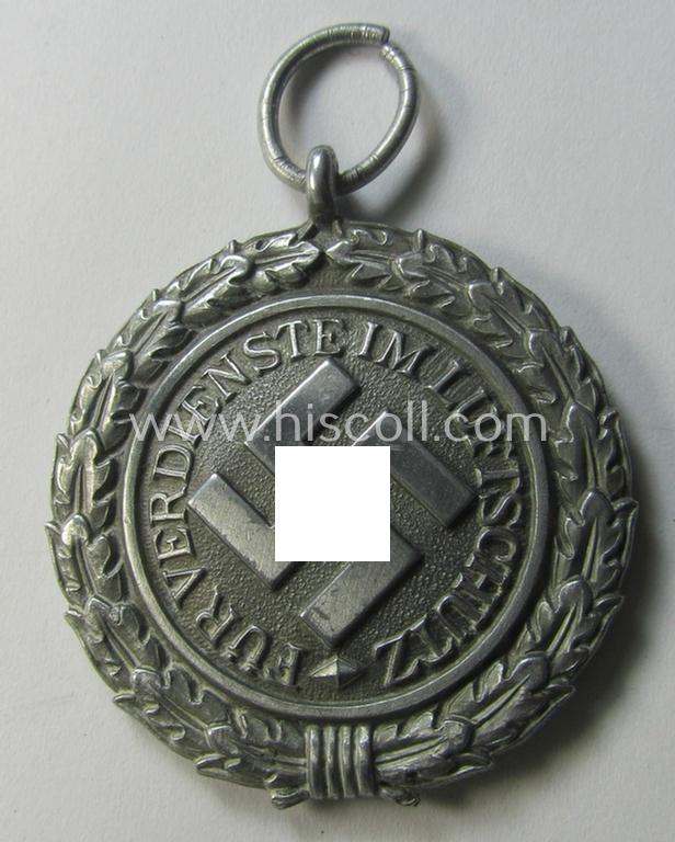 Atttractive, 'Luftschutz-Ehrenzeichen 2. Stufe' being a maker- (ie. '10'-) marked example as executed in zinc-based metal (ie. 'Feinzink') as was produced by the maker: 'Foerster & Barth'