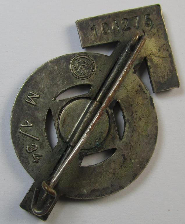 Neat, HJ/BDM- (ie. 'Hitlerjugend'/'Bund Deutscher Mädel'-) so-called: 'Leistungsabzeichen in Silber' being a neatly maker- (ie. 'RzM M1/34'-) marked example that is bearing the unique bearers'-number: '104275'