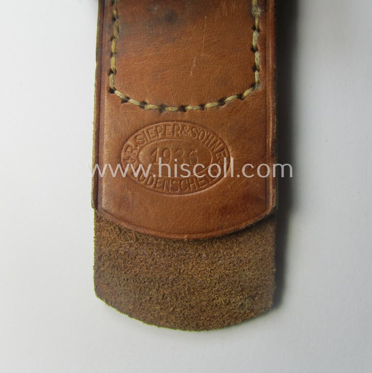 WH (Heeres) 'standard-pattern', field-grey-toned- and aluminium-based belt-buckle being a maker- (ie. 'R. Sieper & Söhne'-) marked- and/or: '1938'-dated example that comes mounted onto its leather-based tab