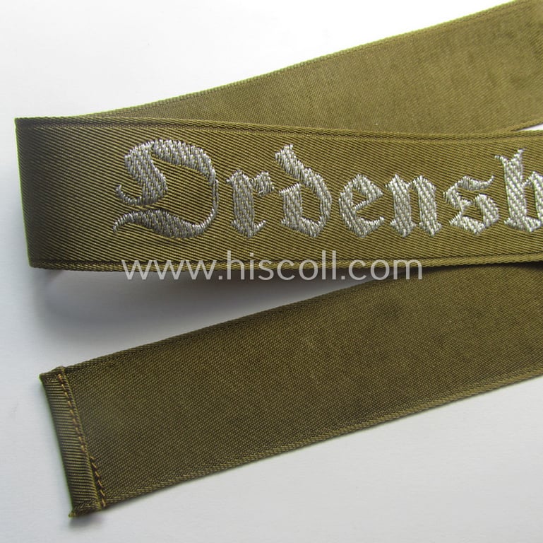 Superb - full length and 'flat-wire'-woven! - 'N.S.D.A.P.'- (ie. 'Politische Leiter'-) related cuff-title (ie. 'Ärmelstreifen') entitled: 'Ordensburgen' (being a 'virtually mint- ie. unissued' example that still retains its 'RzM'-etiket)