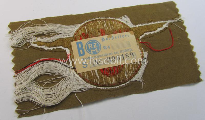 Superb - and rarely encountered! - breast-badge as executed in 'BeVo-weave' pattern as was intended for members within the 'N.S.D.A.P. Reichsautozug' (or: 'RaZ') still retaining its period, paper-based 'RzM'-etiket