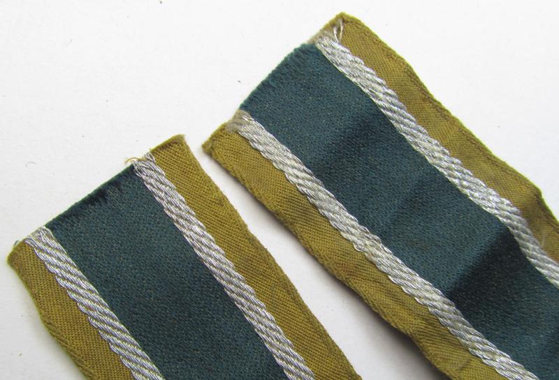Superb, 'BeVo'-like cuff-title (ie. 'Ärmelstreifen') entitled: 'Afrikakorps' being a with certainty issued and worn example that comes in an overall nice- (ie. minimally shortened- and presumably once tunic-attached-), condition