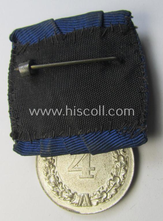 Attractive, silver-toned WH (Heeres o. KM) so-called: 'Einzelspange' showing a: 'WH-Dienstauszeichnung 4. Stufe' (as was intended for 4 years of loyal-service) and that shows a detailed, Heeres o. KM-type-eagle-device, period-attached