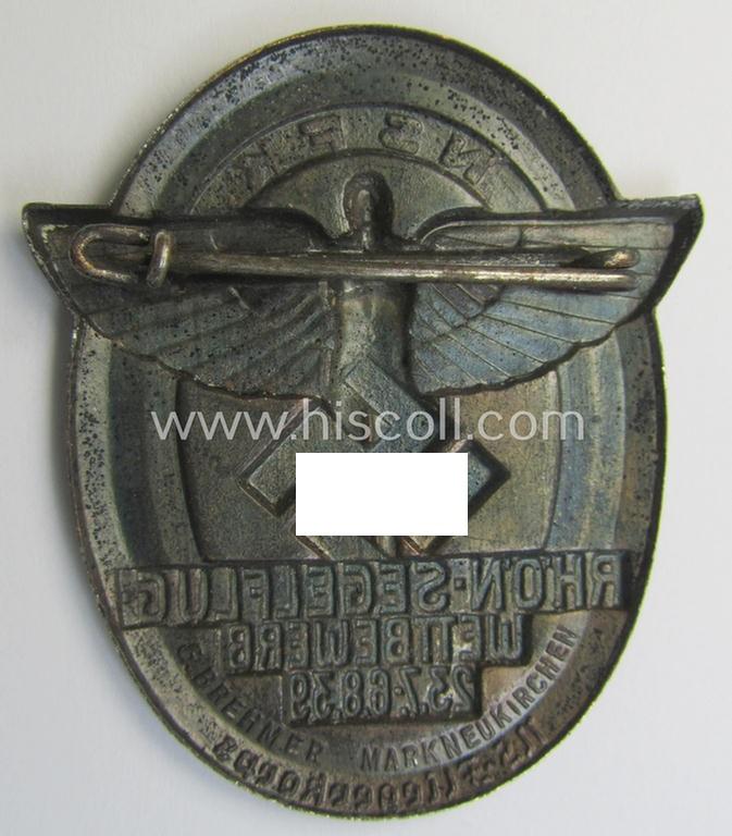 Reddish-bronze-toned, N.S.F.K.-related day-badge (ie. 'tinnie') being a maker- (ie. 'G. Brehmer'-) marked example as was issued to commemorate a specific meeting ie. national rally entitled: 'N.S.F.K. Rhön-Segelflug Wettbewerb 23.7.-6.8.39'