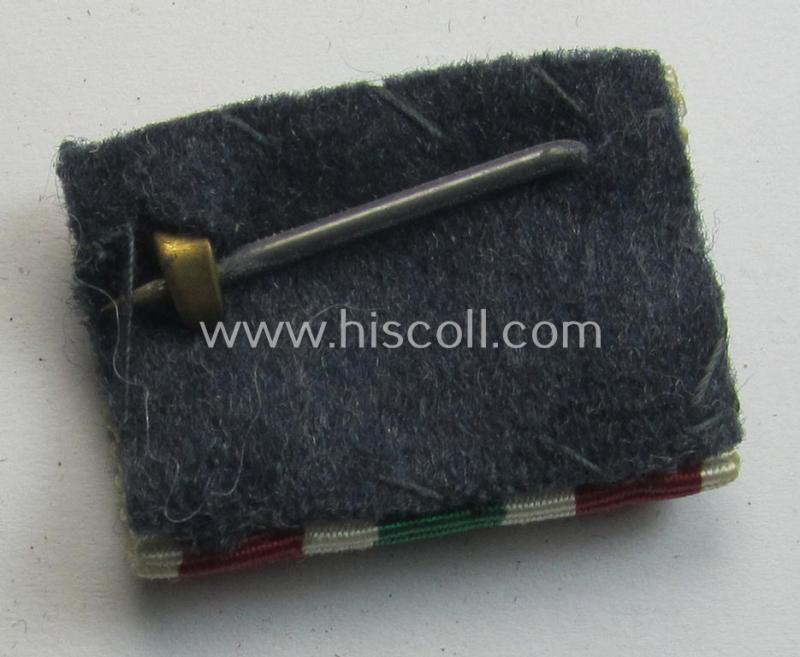 Single-pieced - and actually scarcely found! - WH (Heeres, LW etc.) ribbon-bar (ie. 'Band- o. Feldspange') showing the ribbon for a WH Memel- (ie. 'Memelland'-) 'Anschluss'- (ie. occupation-) medal: '22 März 1939'