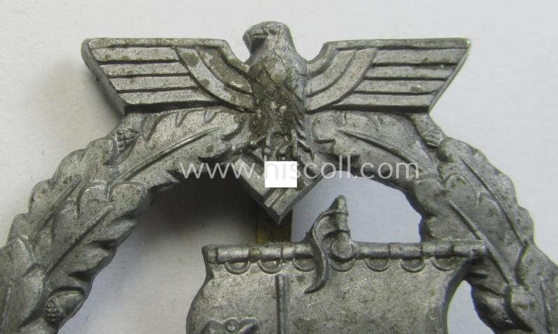 WH (KM) 'Hilfskreuzer-Kriegsabzeichen' (or: auxiliary-cruiser war-badge) being a typical, non-maker-marked- and/or: 'Feinzink'-based example as was produced by the: 'S&L'-company