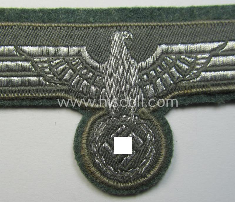 WH (Heeres) breast-eagle as executed in 'BeVo'-type-, so-called: 'flat-wire'-weave-pattern and pre-mounted on field-grey-coloured wool as was specifically intended for usage by soldiers (ie. NCOs) on their dress-tunics (ie. 'Waffenröcke')