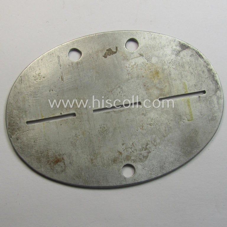 Superb - and scarcely found! - typical aluminium-based, WH (Heeres-) ie. 'Panzer'-related ID-disc (ie. 'Erkennungsmarke') bearing the clearly stamped unit-designation that reads: '2./Pz.R.4' and that comes as issued and/or worn