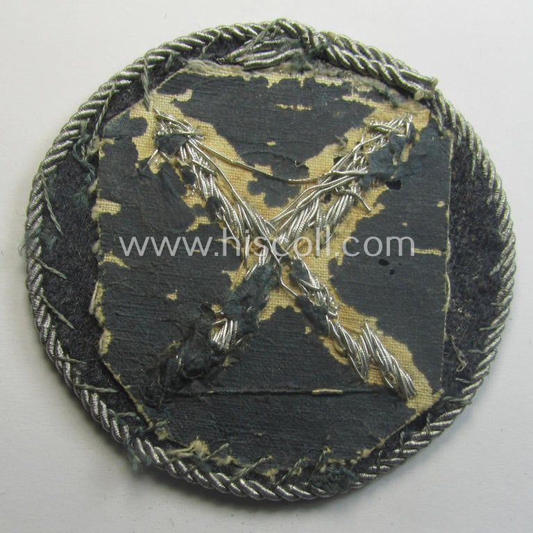 Superb - and rarely encountered! - example of a WH (Luftwaffe) hand-embroidered, trade- ie. special-career-patch (ie. 'Tätigkeitsabzeichen') having a silverish-grey-toned 'Kordel' attached as was intended for: 'LW-Fernschreib-Unteroffiziere'