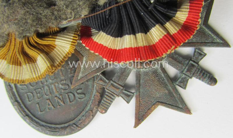 Neat - and clearly used! - two-pieced medal-bar (ie. 'Ordenspange') showing resp. a: 'Kriegsverdienstkreuz 2. Klasse mit Schwn.' and a: 'Westwall'-medal that come period-mounted as a: 'Doppelspange'
