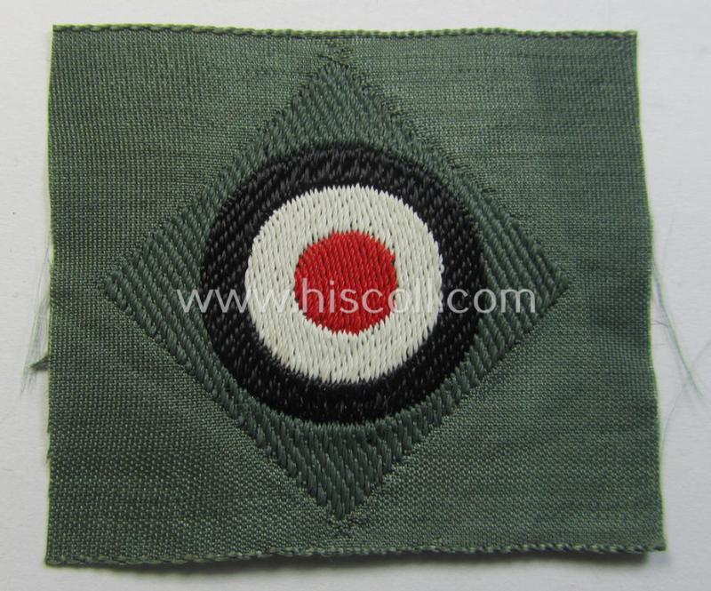 Early- (ie. mid-) war-period, WH (Heeres) cap-eagle & cocarde-set (ie. 'Schiffchenmützen-Adler u. Kokarde für Mannschaften u. Uffz.') being a 'virtually mint' set as executed in bluish-grey-coloured linnen on a field-grey-coloured background